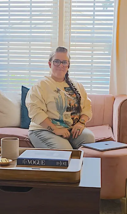 The Writer Page, writing strategies, freelance writing, copywriting, ghostwriting, editing, proofreading, The Writer Page writing strategies for every writer, Paige sitting on the couch preparing to write on her laptop.
