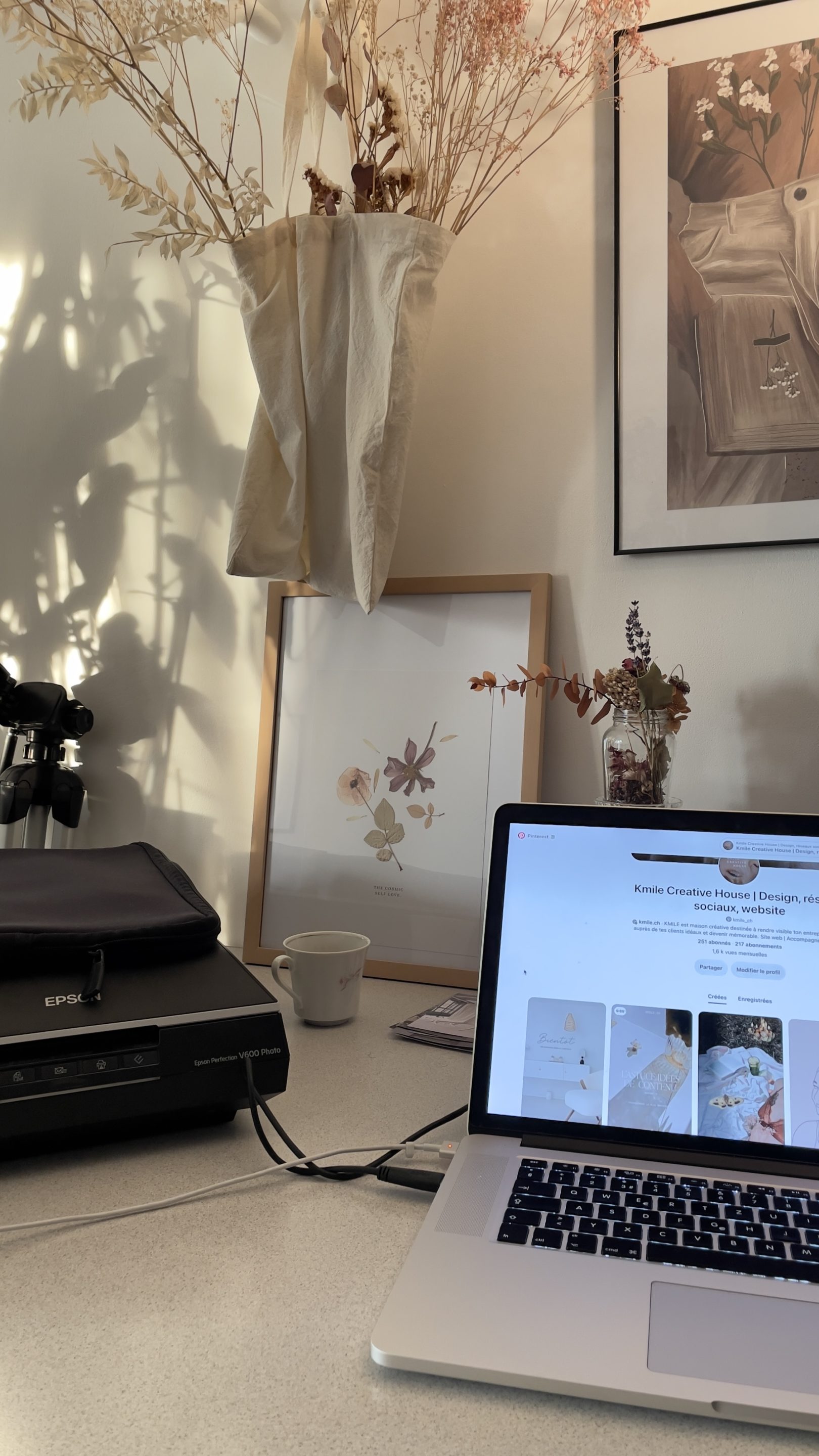 Workspace with a laptop and morning sunlight, representing professional blogging for profit.